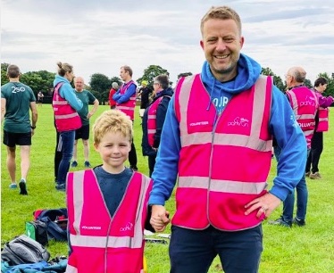 Tom Williams and his son Aston on parkrun volunteer duty