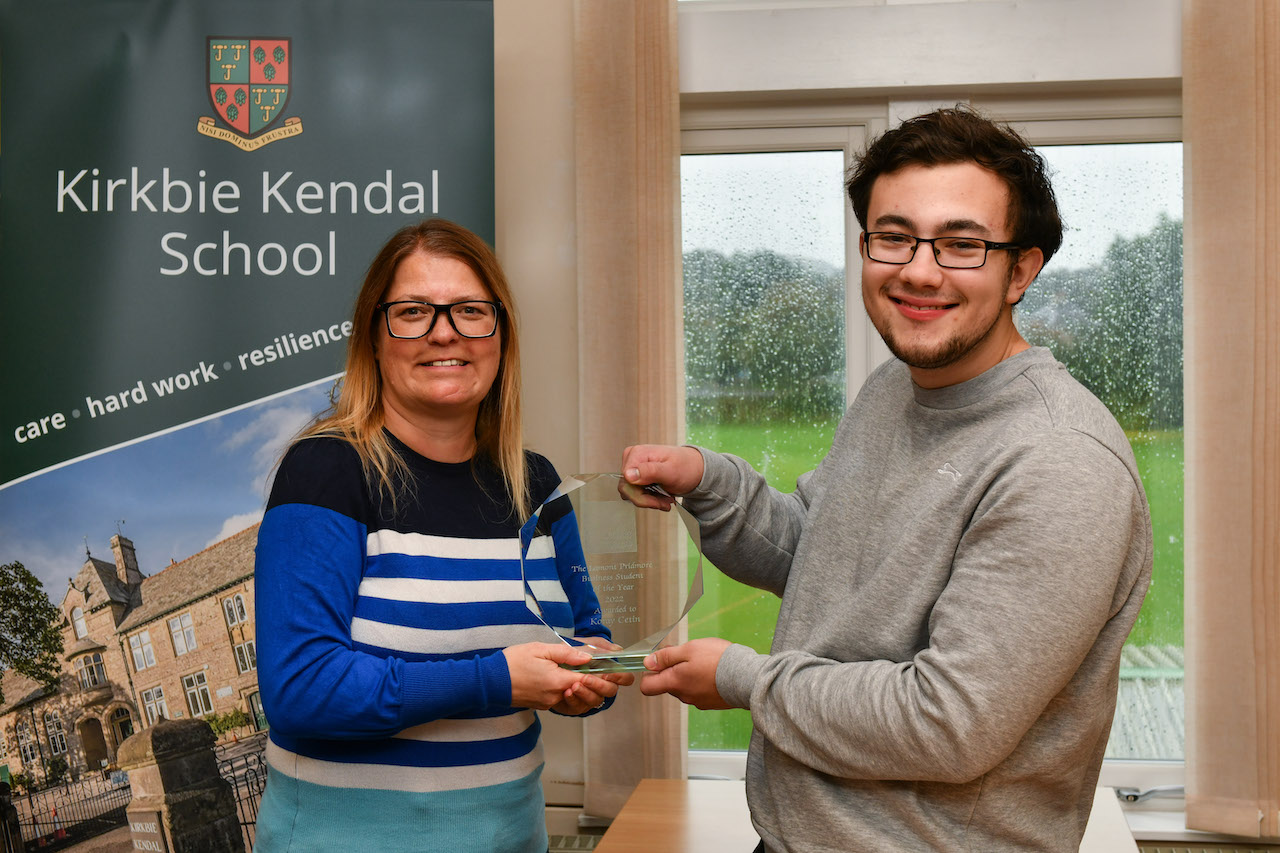 Kerry Hindson (left), Tax Director, Lamont Pridmore, presents the Business Student of the Year Award to Koray Cetin at Kirkby Kendal School.