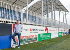 James Higgins pictured by the Barrow FC 32West stand