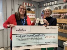 Cheers - Gina Pennington presenting the £5,087 to Carer Support South Lakes Fundraising Manager Marian Graveson at the Pennington’s Coffee & Tea HQ in Kendal.