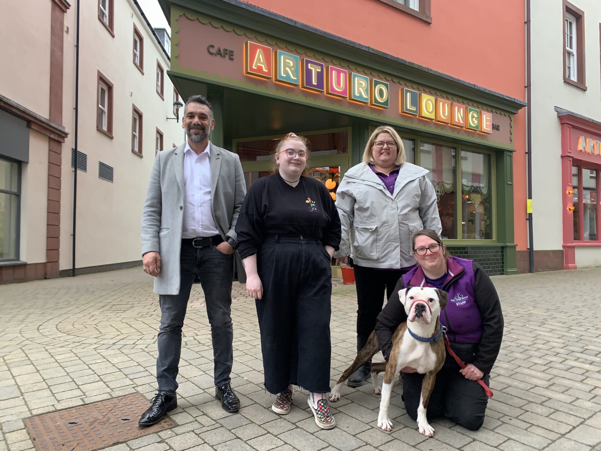 CAPTION Thor the rescue dog says a big ‘Thank you ‘ to Arturo Lounge for their fundraising for Eden Animal rescue left-to-right Arturo Lounge General Manager, Erkan Seker Arturo Lounge Community Rep, Jacki Brown, Eden Animal Rescue General Manger, Sarah Bean and Eden Animal Rescue team member Ashley Gargett.