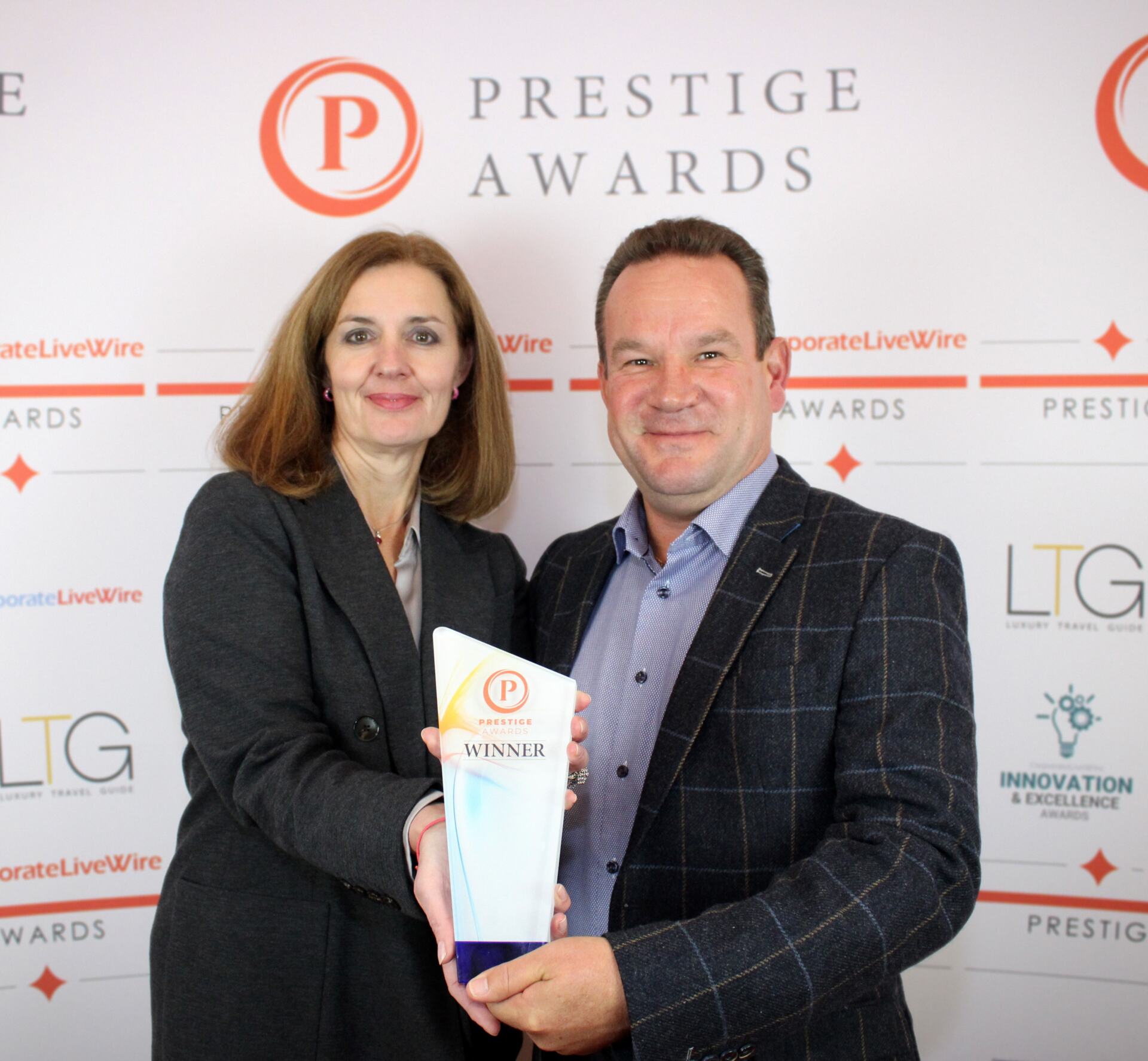 Joanne and Andrew Hunter acccept their Prestige Award
